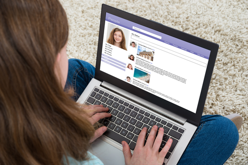 Close-up,Of,Girl,Chatting,On,Social,Website,With,Laptop